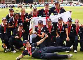 The England team poses with the ICC Women's World Twenty20 trophy after beating New Zealand by six wickets at Lord's